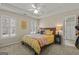 Comfortable bedroom features a tray ceiling, plush carpet, and plenty of natural light at 125 Tall Timber Ct, Fayetteville, GA 30215