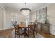 Sophisticated dining room with a crystal chandelier and beautiful natural light at 125 Tall Timber Ct, Fayetteville, GA 30215