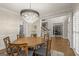 Charming dining room with hardwood floors that opens to the foyer and the home office at 125 Tall Timber Ct, Fayetteville, GA 30215