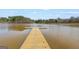 The community lake features a wooden dock, ideal for fishing or enjoying waterfront views at 125 Tall Timber Ct, Fayetteville, GA 30215
