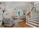 Bright hallway with hardwood floors, a view of the staircase, and an open layout for a seamless flow at 125 Tall Timber Ct, Fayetteville, GA 30215