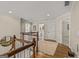 Traditional hallway with a wood floor, white trim, a decorative carpet and multiple doors at 125 Tall Timber Ct, Fayetteville, GA 30215