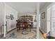 Stylish home office featuring hardwood floors and custom built-in shelving at 125 Tall Timber Ct, Fayetteville, GA 30215