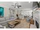 Spacious living room with a fireplace, an open concept design, and a view into the kitchen at 125 Tall Timber Ct, Fayetteville, GA 30215