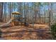 A community playground featuring a slide, climbing structure, and swings offers outdoor fun at 125 Tall Timber Ct, Fayetteville, GA 30215