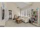 Inviting sitting area features vaulted ceiling, lots of windows, and a comfortable white sofa at 125 Tall Timber Ct, Fayetteville, GA 30215