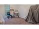 Modest bedroom with standard window, chair and desk space ready for your personal touches at 1942 Grove Way, Hampton, GA 30228