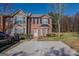 Charming two-story townhome with a well-maintained lawn and driveway at 1942 Grove Way, Hampton, GA 30228