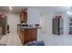 Bright kitchen with tiled floors, plenty of counter space, and modern appliances at 1942 Grove Way, Hampton, GA 30228