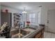 Functional kitchen with tiled floors, a breakfast bar, and ample lighting at 1942 Grove Way, Hampton, GA 30228
