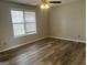 Cozy bedroom with ceiling fan and window provides ample natural light at 11 Carriage Lake Dr, Stockbridge, GA 30281