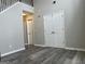 Inviting entryway with gray walls, a high ceiling, and durable wood-look flooring at 11 Carriage Lake Dr, Stockbridge, GA 30281