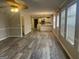 Open-concept living room with durable flooring connecting to the kitchen area at 11 Carriage Lake Dr, Stockbridge, GA 30281
