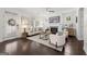 Inviting living room with a fireplace, stylish furnishings, and ample natural light from the large windows at 1977 Boyd Trace Nw Ln, Atlanta, GA 30318