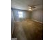 Neutral bedroom with plush carpeting, ample natural light, and a ceiling fan at 2066 Tidwell Trl, Stone Mountain, GA 30088