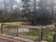 Backyard deck overlooking a large, tree-filled yard perfect for outdoor enjoyment at 1694 Social Circle Fairplay Rd, Social Circle, GA 30025