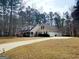 Charming home featuring a driveway and a two-car garage nestled among mature trees at 3213 Sweetbriar Dr, Villa Rica, GA 30180