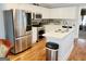 Updated kitchen featuring stainless steel appliances and white cabinets at 3213 Sweetbriar Dr, Villa Rica, GA 30180
