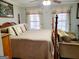 Comfortable bedroom with a four-poster bed, soft colors, and natural light at 3213 Sweetbriar Dr, Villa Rica, GA 30180