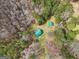 Overhead aerial of cabin and utility building nestled within a densely wooded area, providing privacy at 1266 Martin Mill Rd, Moreland, GA 30259