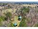 Wide aerial view of cabin, utility building, and the surrounding countryside, showing large lots at 1266 Martin Mill Rd, Moreland, GA 30259
