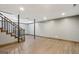Finished basement with wood-look floors, support columns, and neutral paint at 1266 Martin Mill Rd, Moreland, GA 30259
