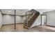Basement space featuring hardwood floors, stairs, and recessed lighting at 1266 Martin Mill Rd, Moreland, GA 30259