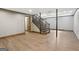 Finished basement features wood-look flooring, recessed lighting, and staircase at 1266 Martin Mill Rd, Moreland, GA 30259