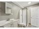 Updated bathroom with modern vanity, glass-enclosed shower, and white fixtures at 1266 Martin Mill Rd, Moreland, GA 30259