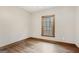 Bedroom with hardwood flooring, window, and base trim at 1266 Martin Mill Rd, Moreland, GA 30259