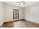 Bedroom with hardwood flooring, base trim, window, and natural light at 1266 Martin Mill Rd, Moreland, GA 30259