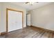 Bedroom featuring hardwood flooring, closet, and a door to another room at 1266 Martin Mill Rd, Moreland, GA 30259