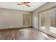 Inviting living room boasts wood-look floors, neutral walls, natural light and an outdoor deck at 1266 Martin Mill Rd, Moreland, GA 30259