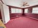 Bedroom features ceiling fan, carpeted floors, and windows at 1683 Candler Rd, Decatur, GA 30032