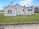 Exterior view of a single story home with grass in the rear yard at 1683 Candler Rd, Decatur, GA 30032
