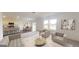 Spacious living room featuring modern decor, neutral colors, and an open concept at 166 Silverton Dr, Dacula, GA 30019