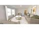Well-lit living room showcasing a comfortable sofa, modern decor, and large windows at 166 Silverton Dr, Dacula, GA 30019