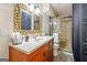 Bathroom featuring a marble countertop vanity with elegant framed mirror and glass shower at 2431 Weatherford Ct, Marietta, GA 30068