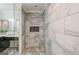 Beautiful bathroom showcasing a tiled shower with a niche and glass door with sleek fixtures at 2431 Weatherford Ct, Marietta, GA 30068