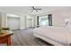 Large bedroom with wood-look flooring, ceiling fan, and plenty of closet space at 2431 Weatherford Ct, Marietta, GA 30068