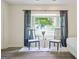 Bright bedroom featuring a cozy seating area with a large bay window and wood floors at 2431 Weatherford Ct, Marietta, GA 30068