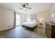 Bright bedroom features modern gray walls, ceiling fan, and television at 2431 Weatherford Ct, Marietta, GA 30068