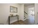 Bright entryway featuring wood floors, a decorative mirror and staircase at 2431 Weatherford Ct, Marietta, GA 30068