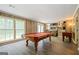 Spacious game room featuring a pool table, foosball table and large windows at 2431 Weatherford Ct, Marietta, GA 30068