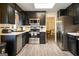 Updated kitchen features stainless steel appliances, stone countertops, and a light wood floor at 2431 Weatherford Ct, Marietta, GA 30068