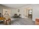 Open-concept living room with wood floors that flows into the dining room at 2431 Weatherford Ct, Marietta, GA 30068