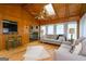 Spacious living room featuring hardwood floors, skylights and a ceiling fan at 2431 Weatherford Ct, Marietta, GA 30068