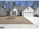 Charming single-Gathering home with a two-car garage and inviting curb appeal in a serene neighborhood at 82 Airmont Dr, Sharpsburg, GA 30277