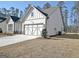 Beautiful home featuring a gray garage door and siding with an attached garage, perfect for a Gathering or individual at 82 Airmont Dr, Sharpsburg, GA 30277
