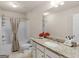 Bathroom featuring granite countertop, white cabinets, tub and shower combination, and tile flooring at 2361 Hanover Woods Rd, Lithonia, GA 30058